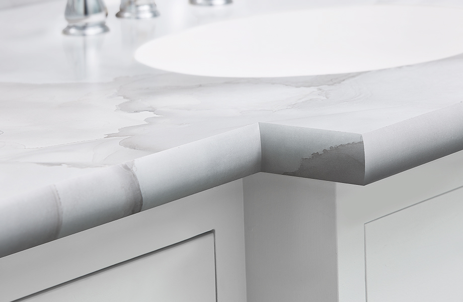 Bathroom countertop and sink with white marbled Formica laminate 